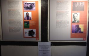 Display board with images and text about 'Characters of Crawley'. These are: Ron Shaw, Romesh Ranganathan, Gareth Southgate, Stuart Harold, John George Haigh, Alfred Morris Jackaman, The Cure.