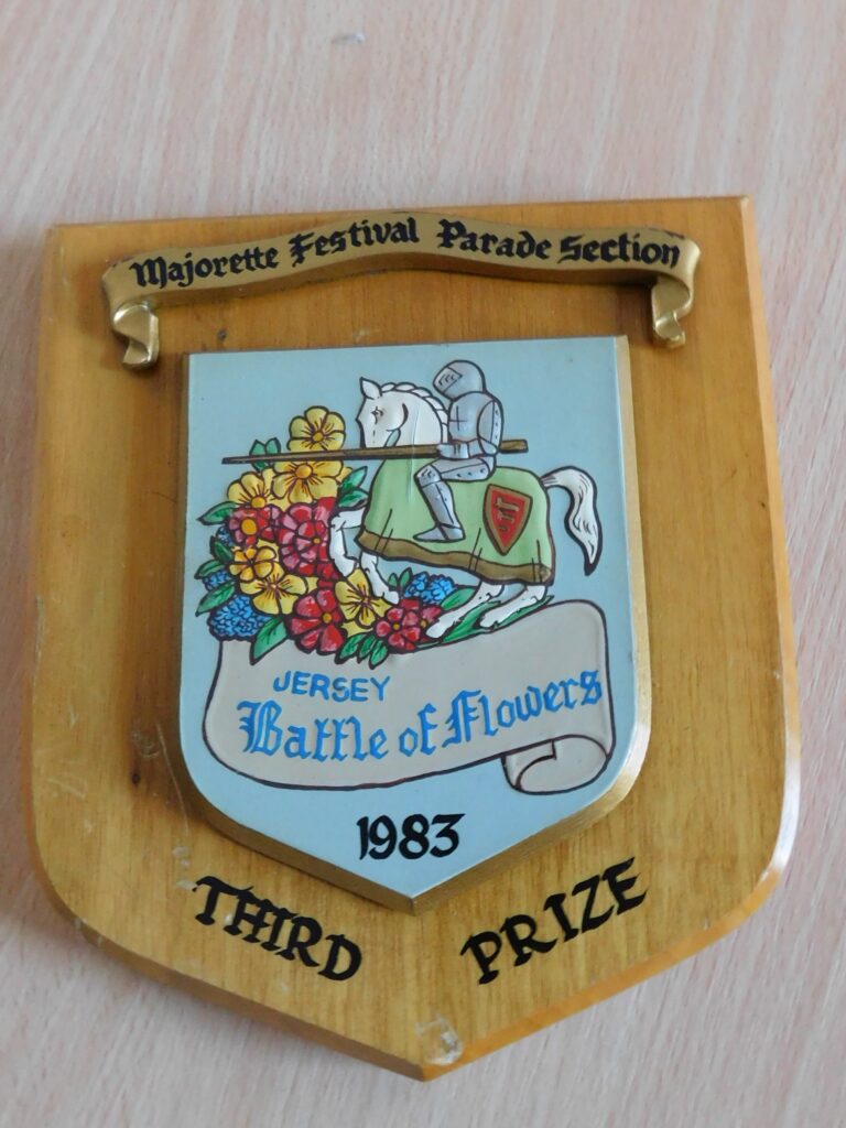 Wooden shield reading @Majorette Festival Parade Section. Jersey Battle of Flowers 1983. Third Prize.