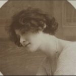 Sepia photograph of a woman looking off to the side.