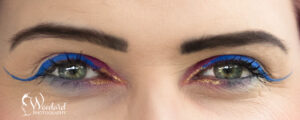 Close up of women's eyes with pink eye make up on