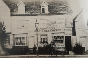 Black and white photograph of building with Bay Tree Coffee House written on the side.